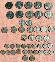 Full lot overview showing all half dollars, quarters, nickels and dimes laid out by denomination