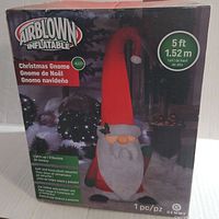 Box showing the Airblown Inflatable Christmas Gnome product image, brand Gemmy, 5 ft tall, with LED lighting and soft plush accents.