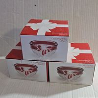 Three boxed Mikasa Celebrations crystal candy dishes stacked on a white surface, showing packaging detail and size.