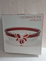 Box showing the Mikasa Celebrations crystal hostess bowl with a red ribbon design.