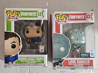 Front view of the two boxed Fortnite Funko Pop figures, Highrise Assault Trooper #431 and Love Ranger #432, showing box conditions and contents.