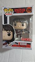 Front view of sealed Stranger Things Eddie Funko Pop #1250 box showing figure through window, branding, and Target exclusive sticker.
