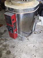 Side view of stainless steel kiln body and top opening ring