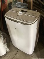 Front view of the white LG portable air conditioner showing overall appearance and condition