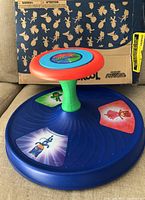Playskool PJ Masks Sit N' Spin toy shown with its original box. The box is slightly squished but toy is new and unused.