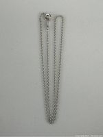 Full view of the 10K white gold chain necklace laid out showing length and clasp.