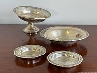 All four dishes displayed together on wood surface