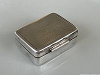 Top view of the antique sterling silver pill box showing the rectangular shape and textured lid surface.