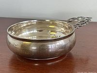 Side view of porringer showing bowl profile and exterior finish
