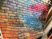 Photo showing the full brick backdrop with multicolor brick pattern suitable for photo shoots.