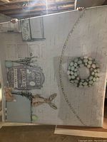 Full view of Easter vinyl photo backdrop showing white brick wall, pastel egg wreath, Easter signs, and bunny decor