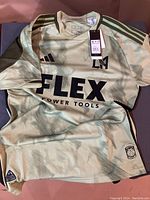 Front view of Adidas LAFC soccer jersey showing FLEX Power Tools sponsor logo, Adidas and LAFC logos, tags attached