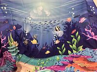 Full view of the marine backdrop featuring various fish and coral design, stretched out to display size and detail.
