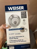 Front of Weiser deadbolt lock packaging showing the product, its key control feature, and suitability for rentals.