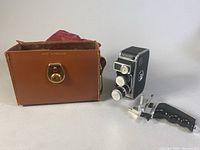 Overview of camera body, grip handle and leather case