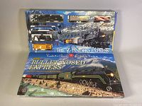 Top of box showing model train set layout with locomotive and freight cars