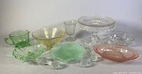 Wide view photo showing all glassware items including cake stand, bowls, measuring cup, and utensil rests.