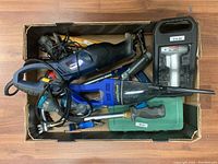 Overhead view of all items in the box showing the variety of tools and accessories included in the lot