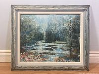 Full front view of the framed painting depicting a misty lagoon scene with trees and water.