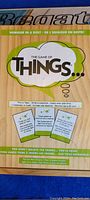 Top of The Game of Things box showing branded front cover with cards and instructions