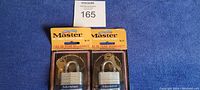 Two brand new Master Lock padlocks No. 3-D in original blister packaging, attached with keys.