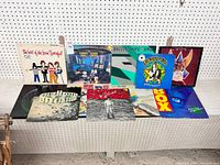 Photo showing 10 vinyl LP records arranged in two rows with various album covers visible including Chemical People, Dazzle Ships, Angel and others.