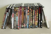 Front view of the row of 20 DVD movies with visible spines showing titles and cover art.