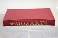 Red slipcase with gold 'MOZART' lettering on spine for the book.