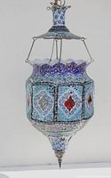 Front view of vintage hand-painted Persian copper hanging lamp showing intricate floral and geometric patterns in blue, red, and white.