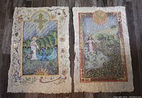 Two mixed media artworks side by side on wooden floor, featuring Saint Anthony of Padua and Saint Peter, each with decorative borders and natural scenes.