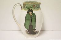 Front view of ceramic jug showing the painted watchman figure in green cloak and hat, standing over a post.