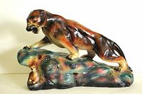 Front view of vintage plaster wildcat lamp showing wildcat standing on base with small fawn figurine underneath