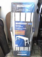 Mastercraft aluminum work platform in original sealed packaging, showing front packaging with brand name and product description.