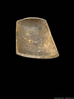 Photo of a single antique wooden dough bowl trencher with visible wear and patina