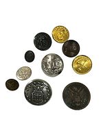 Close-up showing eleven individual antique buttons with various military and service branch insignia including eagle, police, marine, and fire department emblems.