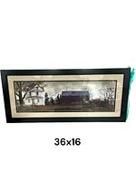 Framed artwork showing a rural farmhouse and barn, 36x16 inches, black frame with cream matting, lights flickering inside.
