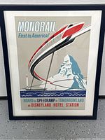 Framed Disney Monorail vintage-style art print showing the attraction and promotional text.