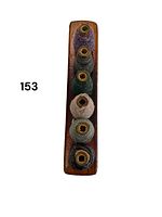 Top-down view of wooden spool holder with six thread spools in various colors