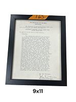 Framed typed citation document on official Navy letterhead, approximately 9x11 inches.