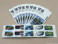 Photo showing eight unopened Canada Post stamp booklets fanned out, each booklet valued at $4.20 and containing 10 stamps