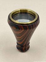 Front view of the prism viewer showing the brass ring with Van Cort Instruments engraving and the clear prism lens.