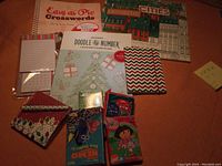 Overview of all books, card games, and stationery items included in the lot