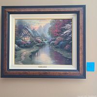Full view of the framed Thomas Kinkade print "A Quiet Evening" showing cottage by the stream with sunset sky.