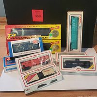 Full lot view showing all eight HO scale train cars in original packaging with clear visibility of boxes and product features.