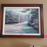 Front view of framed painting showing the full 'Summer Gate' artwork with garden gate, stone pillars, and distant house in soft colors.