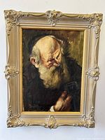 Front view of the antique framed oil painting showing the rabbi portrait and full frame detail.
