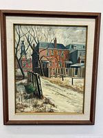 Full view of the framed oil painting showing the winter urban landscape with red brick building and leafless trees.