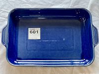 Top view showing the blue interior and side handles of the ceramic baking dish