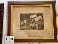 Framed etching by Frank Paton titled 'Not At Home' depicting three dogs around a small animal, shown in its frame with gold inner border and reddish wood outer frame.