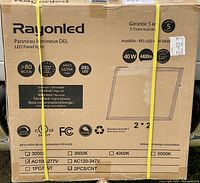 Photo of two boxed Rayon LED ceiling light panels model RO-LED 40W each with specs and warranty details on box.